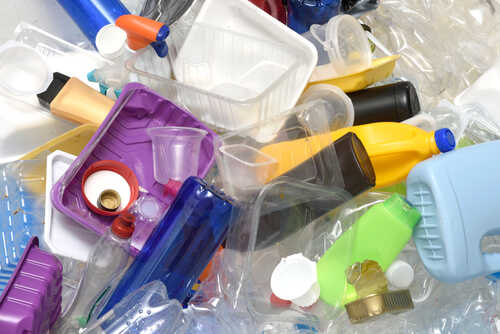 A pile of assorted plastic containers and bottles