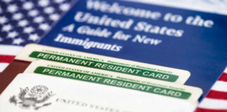U.S. permanent resident cards with immigration guide and flag