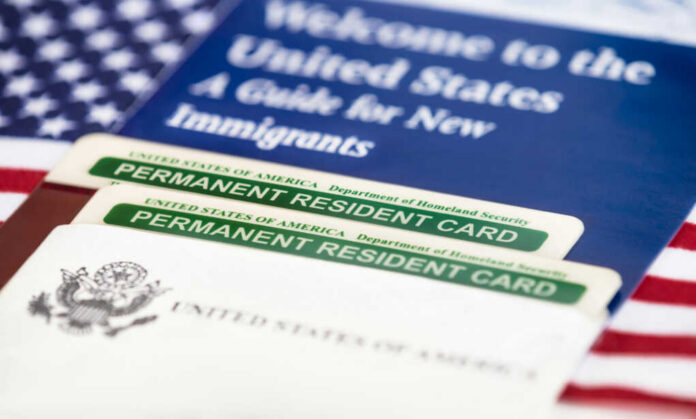 U.S. permanent resident cards with immigration guide and flag