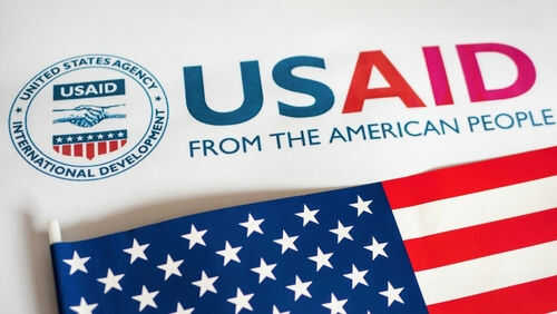 USAID logo with American flag in foreground