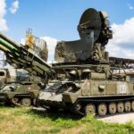Tracked military surface-to-air missile launcher with radar
