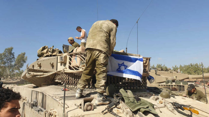 israel-defence-force-military-vehicles-and-soldiers2380888519jpg Soldiers on tank with Israeli flag in open field