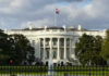 The White House with an American flag flying above it