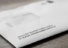 Slow California Ballots Fuel Political Debate Ballot envelope on a wooden surface