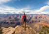 Deadly Weekend Puts Extreme Sports Under Fire Hiker overlooking expansive canyon landscape