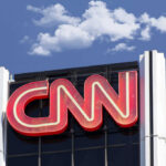 Media Focus Turns To Trump’s Election Rhetoric CNN building sign and blue sky background