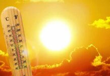 Japan Creates New Heat Category As Temperatures Soar thermometer in front of a blazing sun and orange sky