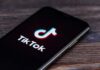 What Changed About TikTok—Really? smartphone displaying the TikTok app logo on screen