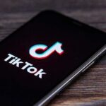 What Changed About TikTok—Really? smartphone displaying the TikTok app logo on screen
