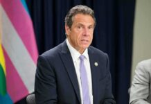 Cuomo Warns His Party Is Losing Its Brand Man in a suit speaking at an event