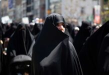 One Ceremony Revealed A Bigger Strategy Women in black attire participating in a protest