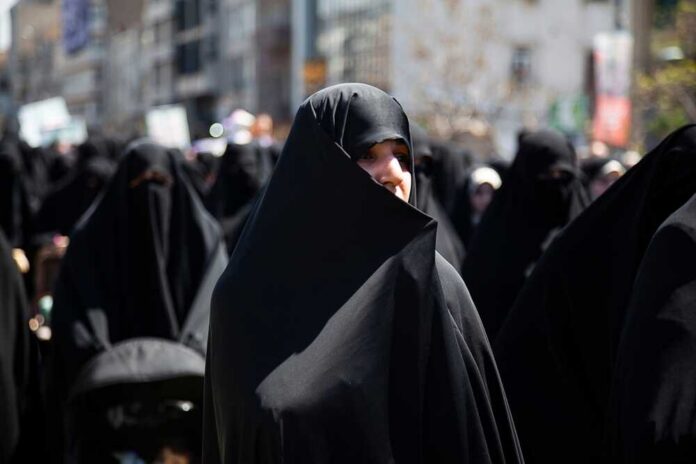 Women in black attire participating in a protest
