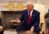 Networks Split Over Trump’s Primetime Election Address A man in a blue suit and red tie gesturing during a discussion in a formal setting