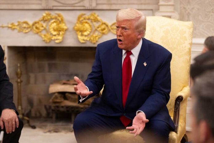 Washington,D.c.,,Usa,-,April,7,,2025:,United,States,President A man in a blue suit and red tie gesturing during a discussion in a formal setting