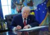 Trump Frees Workers He Says Were Targeted Donald Trump signing documents in the Oval Office