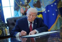 Trump Frees Workers He Says Were Targeted Donald Trump signing documents in the Oval Office