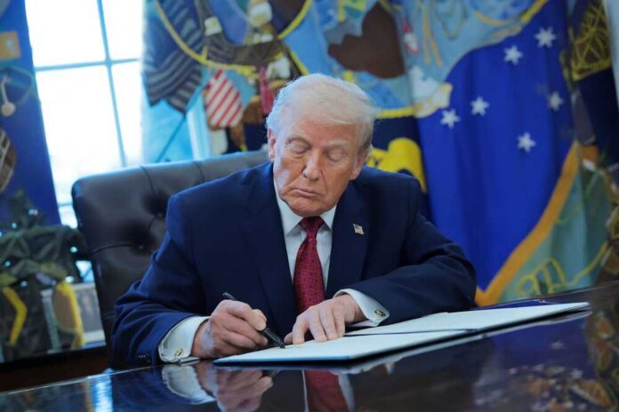 President,Donald,Trump,Signs,Executive,Order,Classifying,Fentanyl,As,A Donald Trump signing documents in the Oval Office