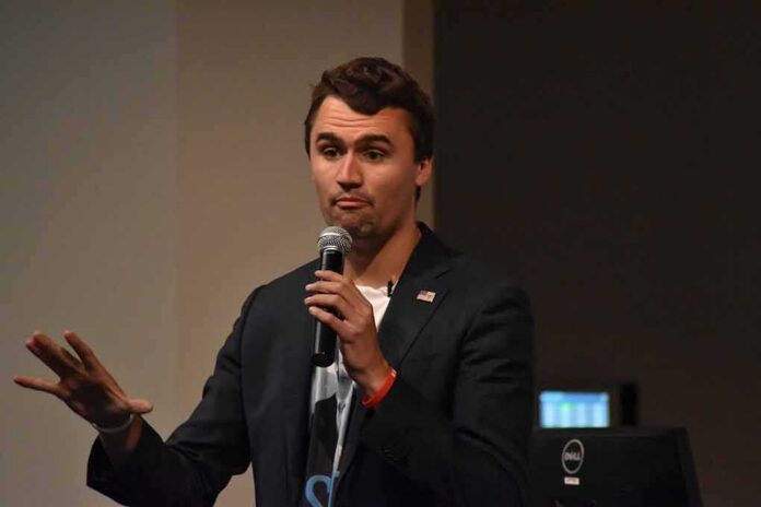 man speaking into a microphone on stage