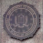 A ‘Shadow Government’ Remark Comes Back Haunting FBI seal mounted on a granite wall