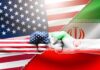 US and Iran flag fists bumping against split flags