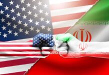 US and Iran flag fists bumping against split flags