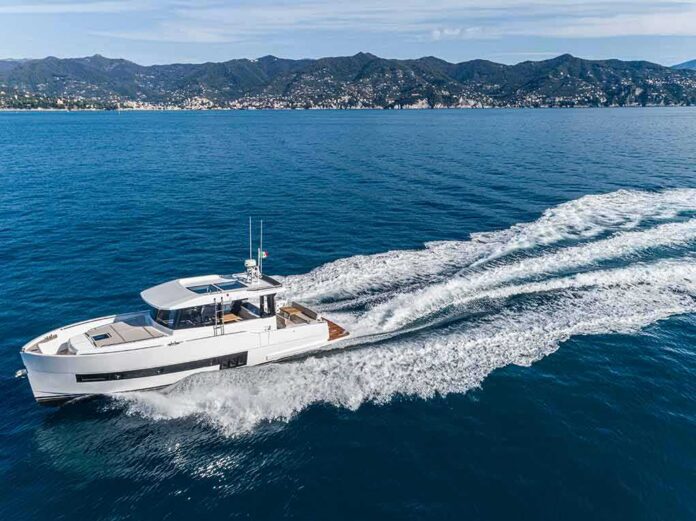 Modern motor yacht cruising on blue sea