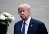 Hormuz Hostage Plan? Trump Slams Brakes man in a suit with an American flag pin
