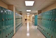 School hallway with rows of teal lockers