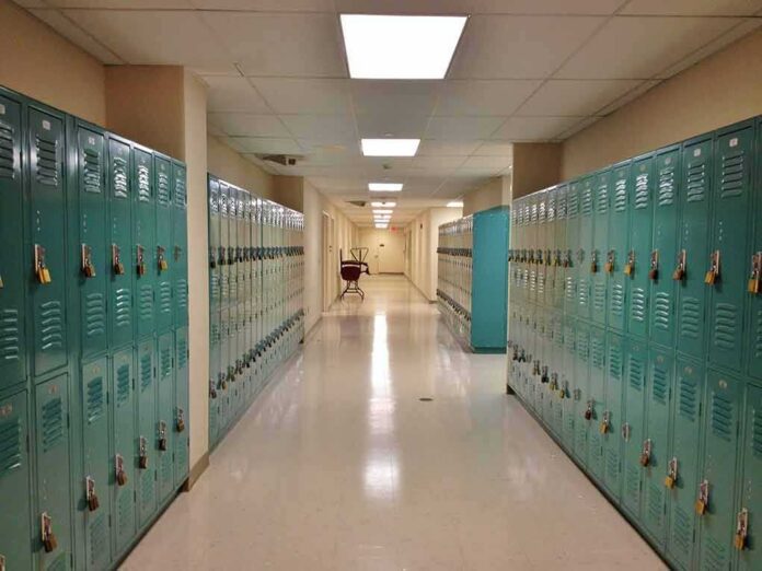 School hallway with rows of teal lockers