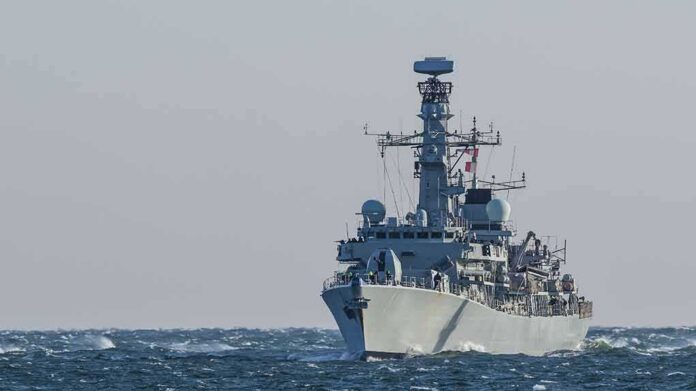 shutterstock_1249750420 naval warship sailing on rough sea