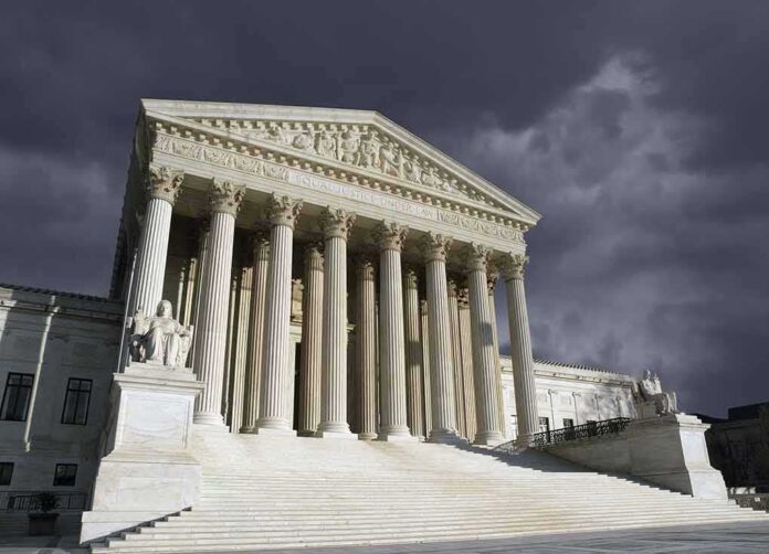 United States Supreme Court building with columns under stormy sky