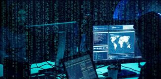 cybersecurity analysts at workstations with code and world map on screens