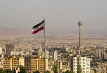 One More Strike Could Widen the Map Iranian flag over Tehran skyline with Milad Tower