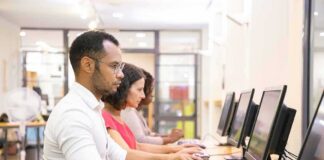People working at desktop computers in a lab