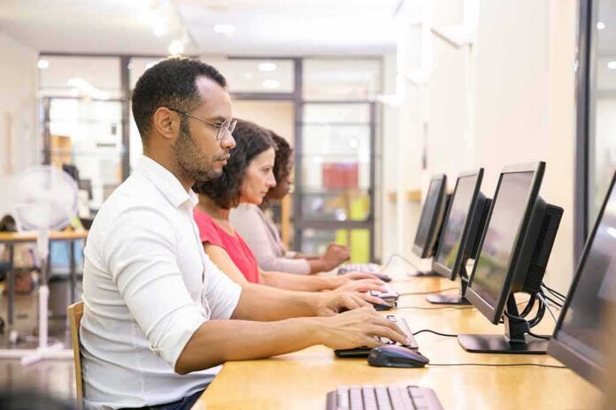 People working at desktop computers in a lab