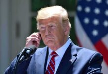Cheating Claims, Zero Scorecards man in suit at podium adjusting earpiece