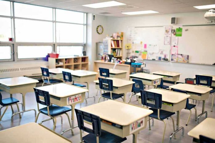 Empty classroom with rows of student desks and chairs