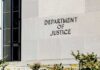 A Notorious Spider Just Landed In America’s Web Department of Justice building exterior wall
