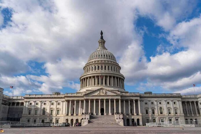 shutterstock_1700044192 United States Capitol building under a partly cloudy sky