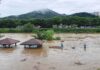 Storms Reload – Drainage Race Begins Rising floodwaters submerge riverside park shelters