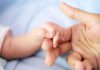Baby Bruises Spark Shocking Hospital Probe baby hand holding adult finger