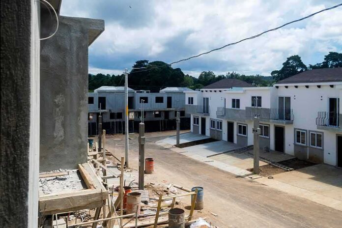 shutterstock_2105802851 Row of newly built townhouses on a construction site