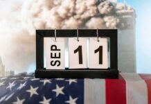 Perpetual desk calendar showing Sep 11 on an American flag