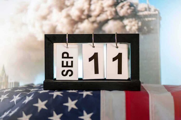 Perpetual desk calendar showing Sep 11 on an American flag