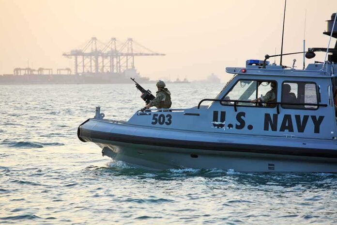 U.S. Navy patrol boat with armed crew on the water