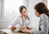 Billions Are Flowing To Low-Value Medicare Care Doctor consulting a patient at a desk