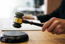 Judge Hammers Coach After Chilling Footage Judge's hand holding a gavel over a sound block
