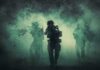 Trump Teases Iran Strike Countdown Soldiers move through dense smoke in a forest