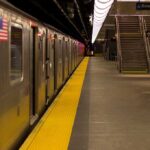 Subway train at an empty underground platform