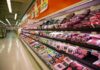 Oven-Hot Aisles: Supermarkets Sabotaged Grocery store meat aisle stocked with packaged beef and poultry